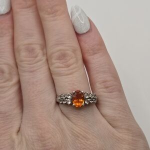 1ct Oval Orange Spessartite With Round White Zircon Rhodium Over Sterling Silver